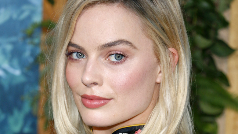 Margot Robbie giving side-eye over shoulder