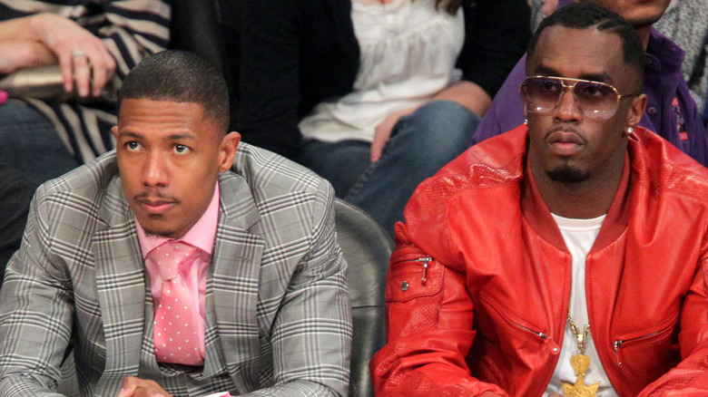 Nick Cannon seated beside Diddy