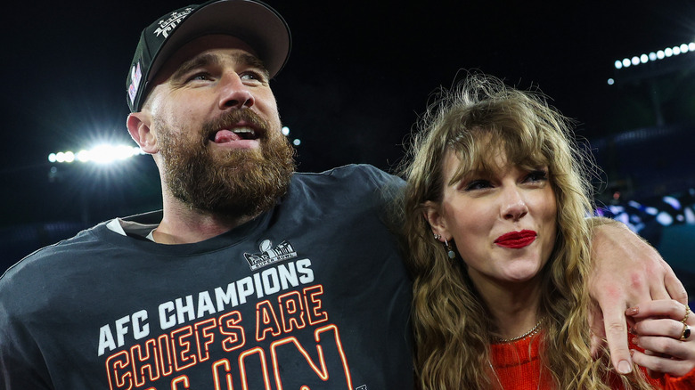 Travis Kelce and Taylor Swift smiling