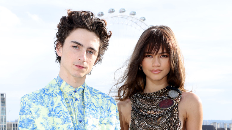 Timothée Chalamet and Zendaya posing for pictures