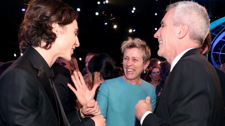 Timothée Chalamet, Frances McDormand, and talent agent Brian Swardstrom laughing