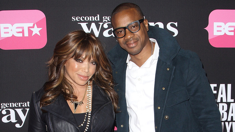 Tisha Campbell and Duane Martin posing