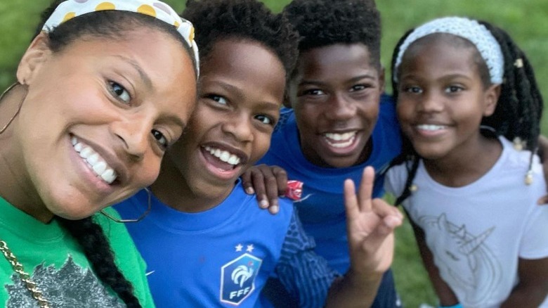 Sheinelle Jones smiling with kids Kayin, Uche, and Clara Ojeh