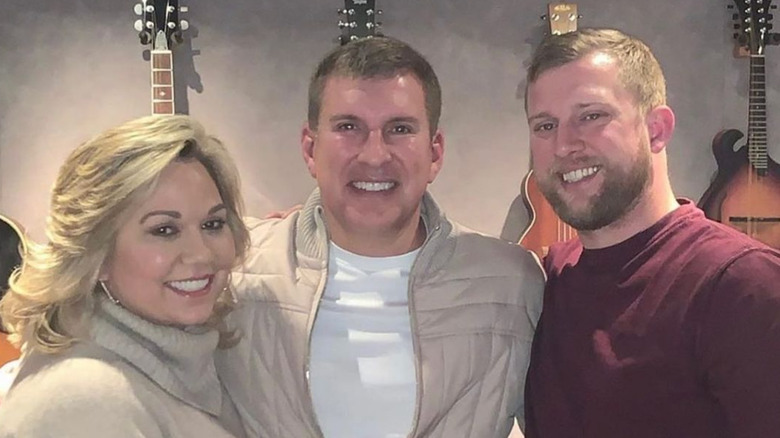 Kyle, Julie, and Todd Chrisley pose 