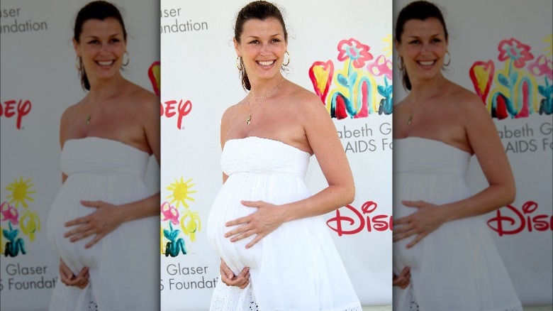 Bridget Moynahan holding her baby bump