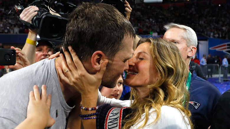 Tom Brady kissing Gisele 