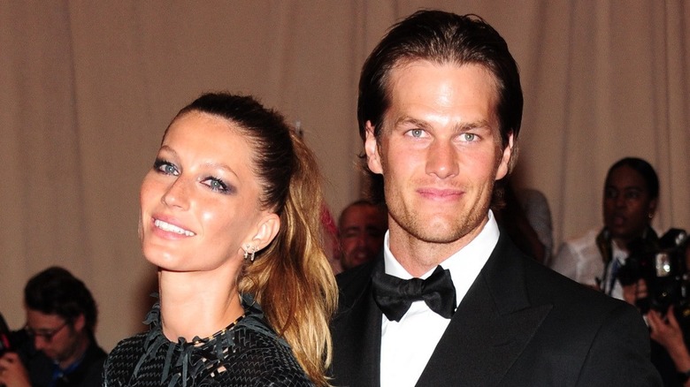 Tom Brady posing with Gisele Bündchen