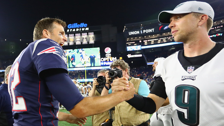 Tom Brady shaking Nick Foles' hand