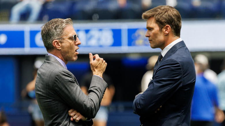 Tom talks to fellow broadcaster on the sidelines.