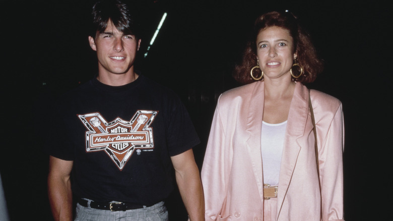 Tom Cruise and Mimi Rogers holding hands