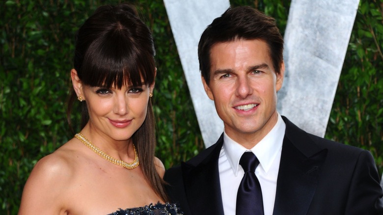 Tom Cruise and Katie Holmes pose at event