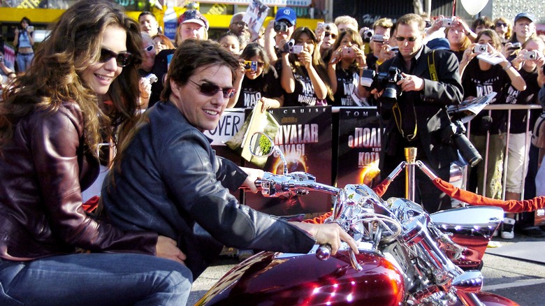 Tom Cruise  and Katie Holmes arrive in a Honda Rune motorcycle