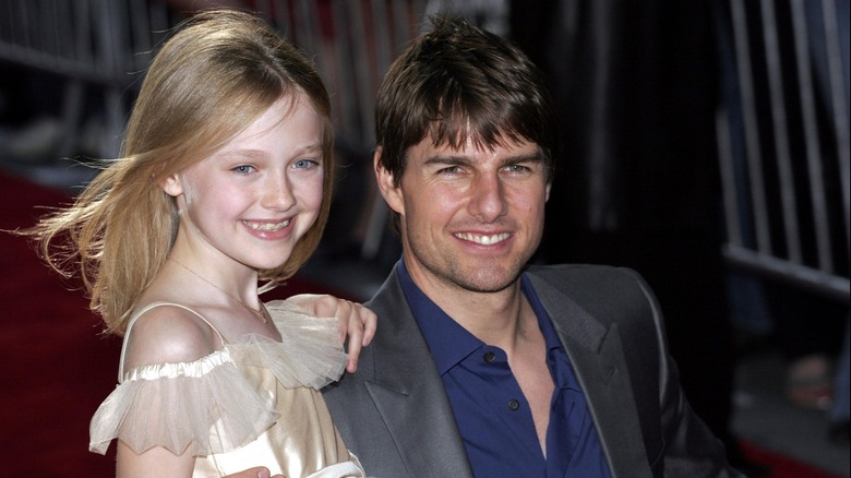 Tom Cruise and young Dakota Fanning all smiles