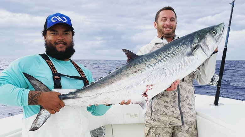 Connor Cruise holding a fish