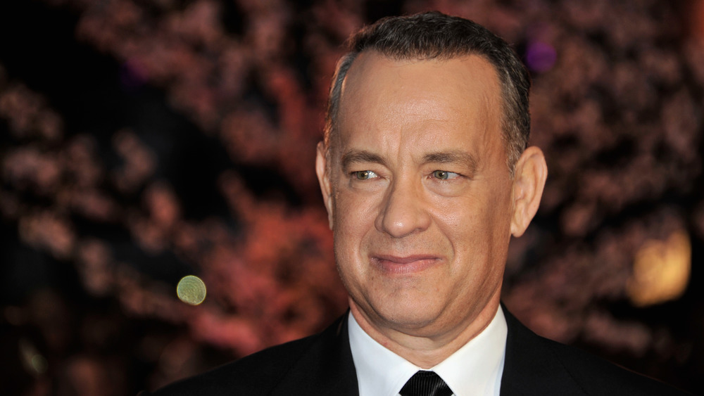 Tom Hanks smiling and posing at an event