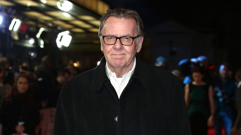 Tom Wilkinson posing in black