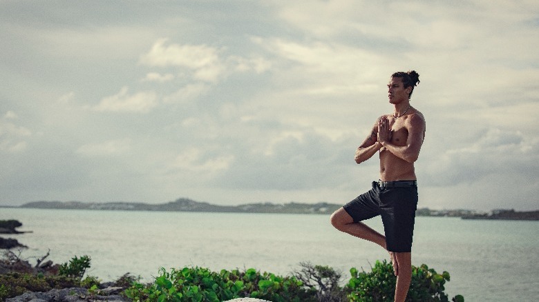 Contestant doing yoga on Too Hot to Handle