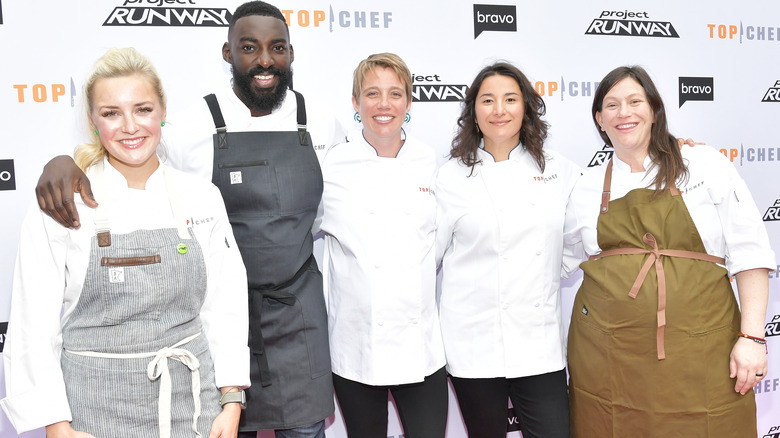 Cast members of Top Chef pose on red carpet