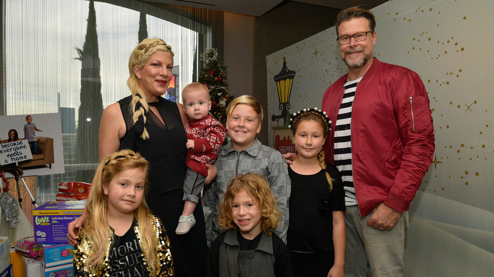 Tori Spelling and Dean McDermott posing with their kids 