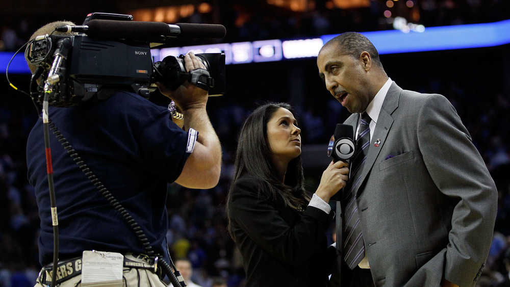 Tracy Wolfson holding a sideline interview