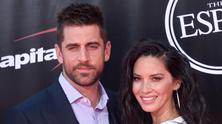 Aaron Rodgers and Olivia Munn posing on the red carpet at the ESPYs