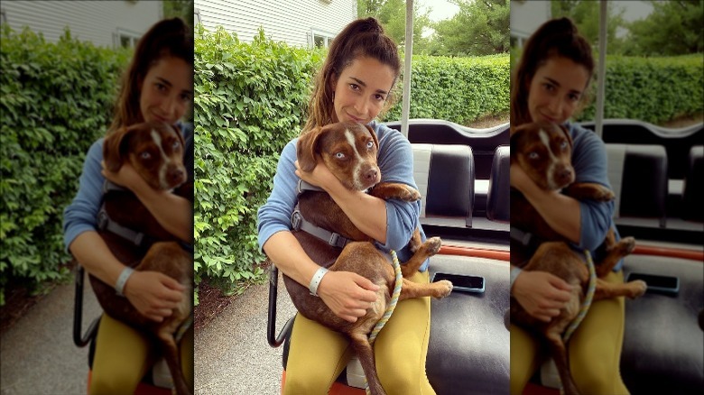 Aly Raisman holding dog Mylo