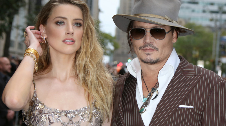 Amber Heard and Johnny Depp smiling 