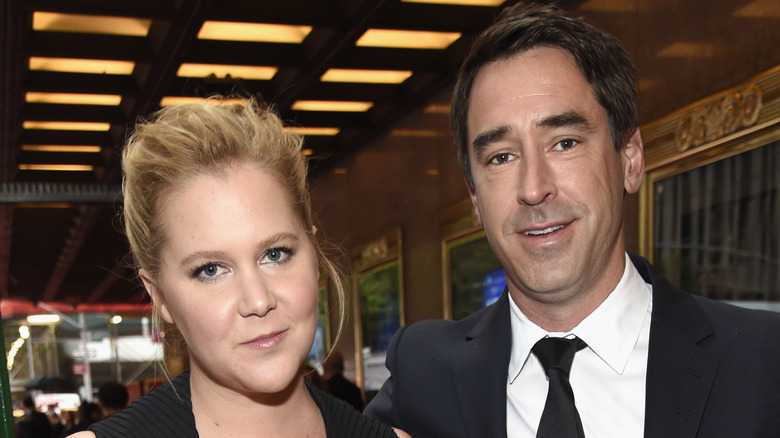 Amy Schumer and Chris Fischer at an event 