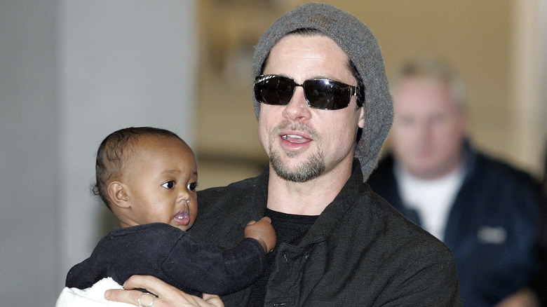 Brad Pitt holds baby Zahara