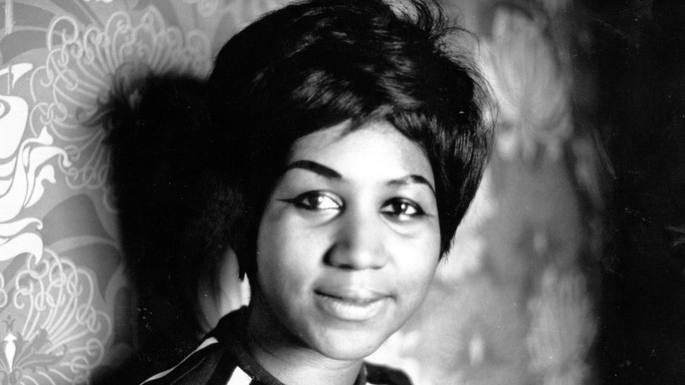 Young Aretha Franklin in a black and white photo