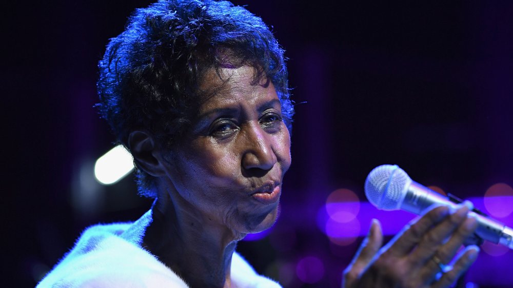 Aretha Franklin with microphone, performing