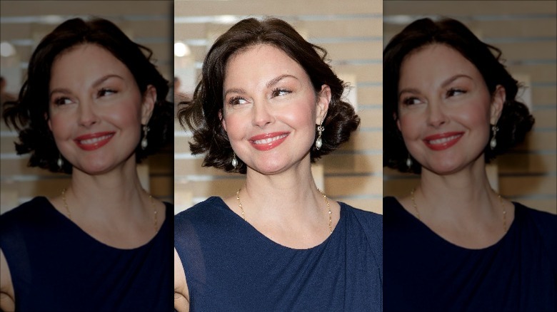Ashley Judd smiling while looking off to the side