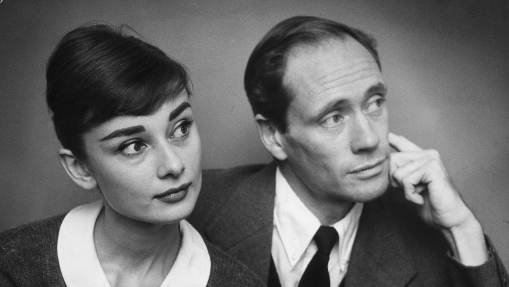 Audrey Hepburn and Mel Ferrer looking concerned in 1960