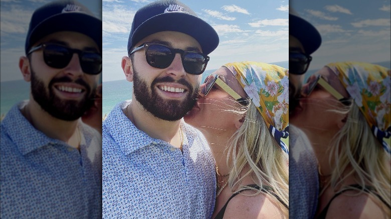 Baker Mayfield being kissed by Emily Mayfield