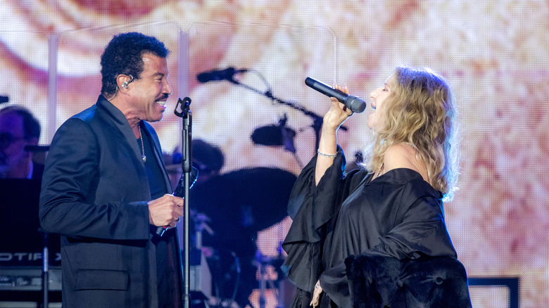 Lionel Richie and Barbra Streisand on stage