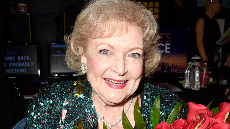 Betty White holding flowers 