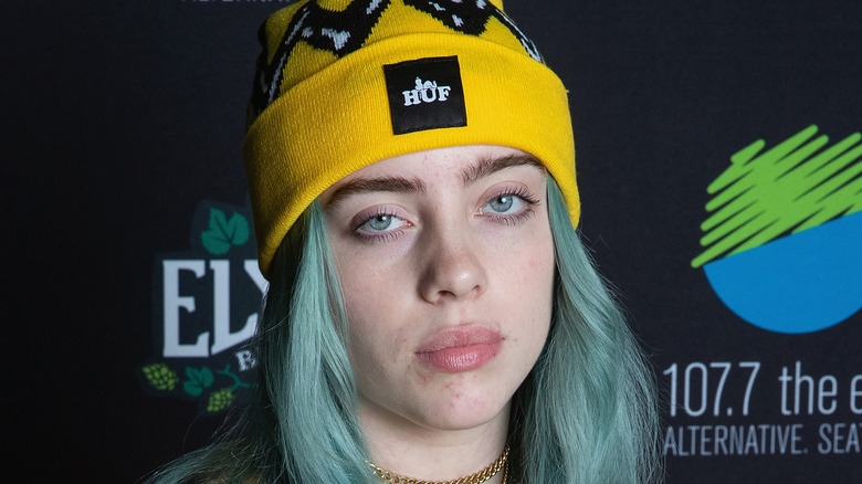 Billie Eilish wearing yellow beanie