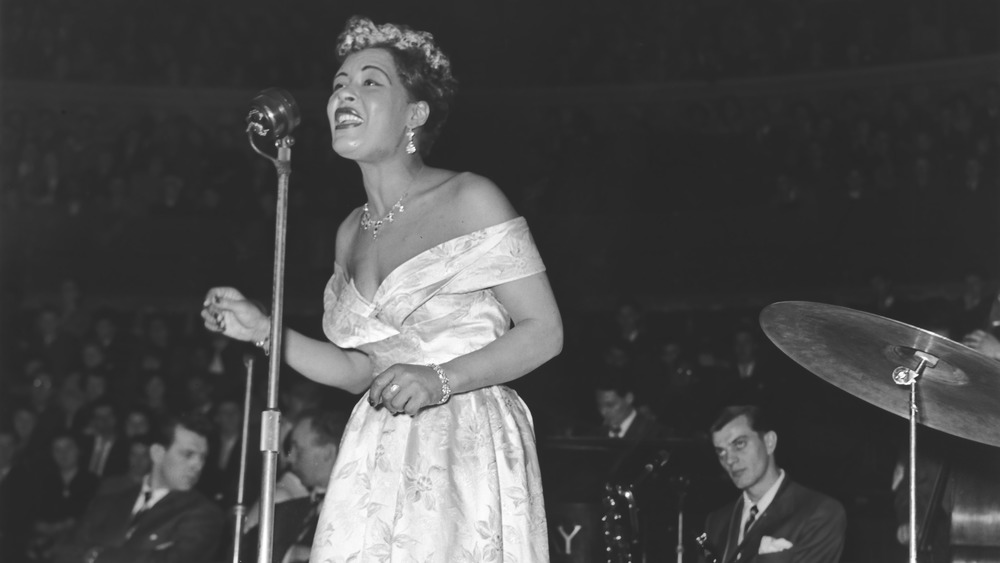 Billie Holiday singing on stage