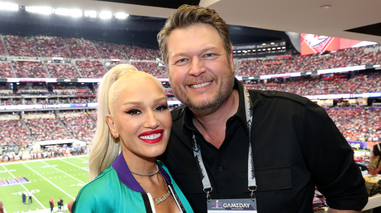 Gwen Stefani and Blake Shelton pose at the Super Bowl