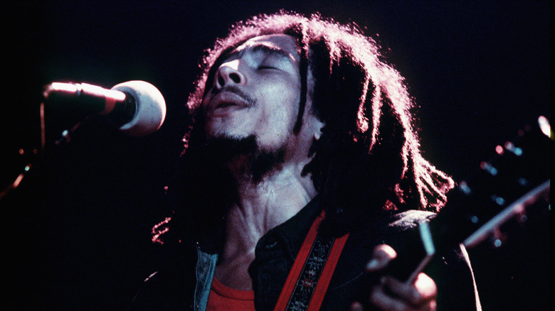 Bob Marley singing into microphone