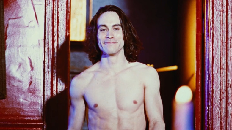 Brandon Lee smiling in doorway