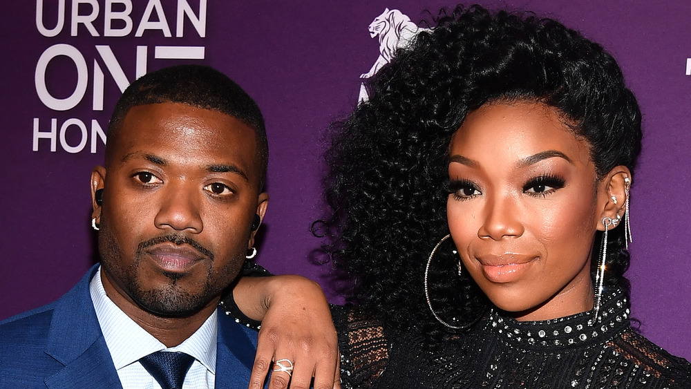 Brandy posing with brother Ray J