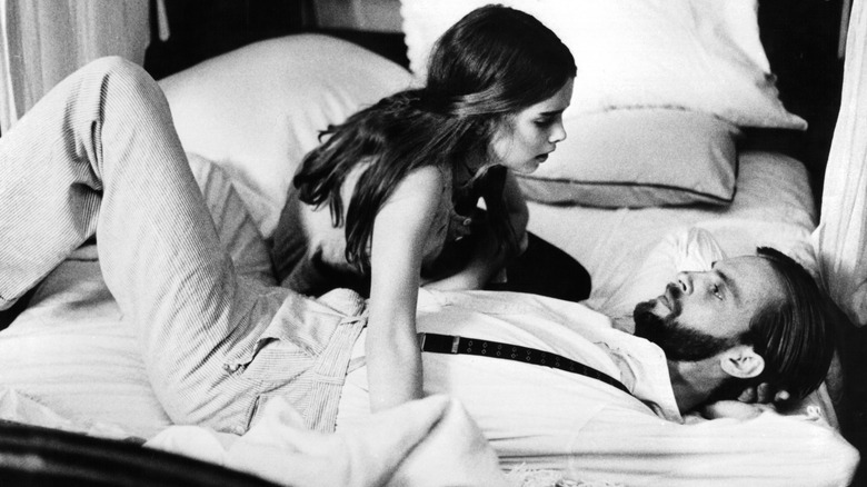 Brooke Shields on a bed with Keith Carradine in Pretty Baby