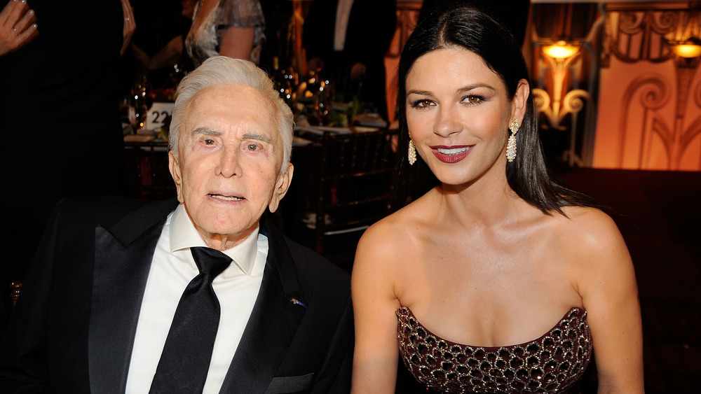 Kirk Douglas and Catherine Zeta-Jones smiling