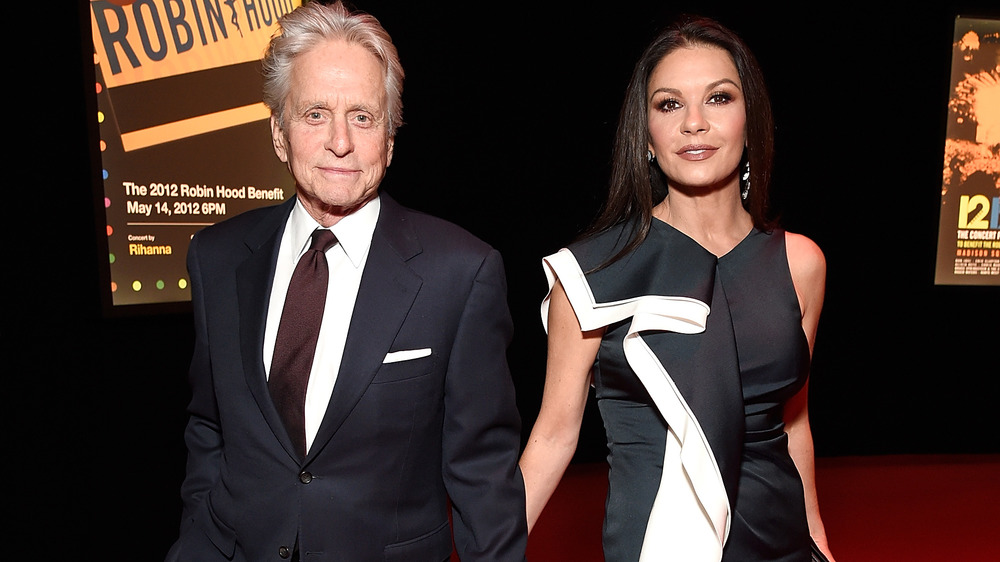 Michael Douglas and Catherine Zeta-Jones holding hands