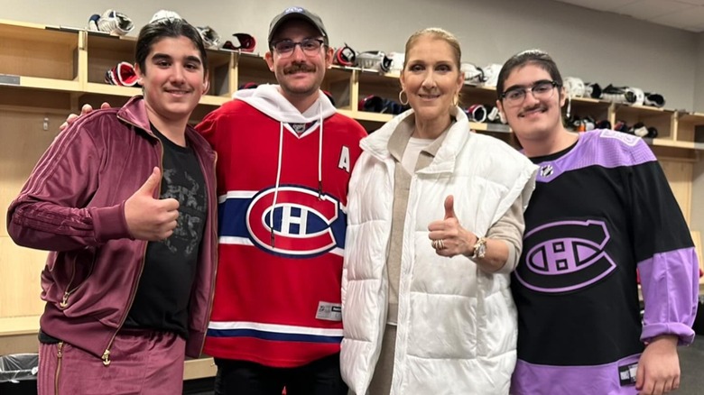 Celine Dion posing with her three sons