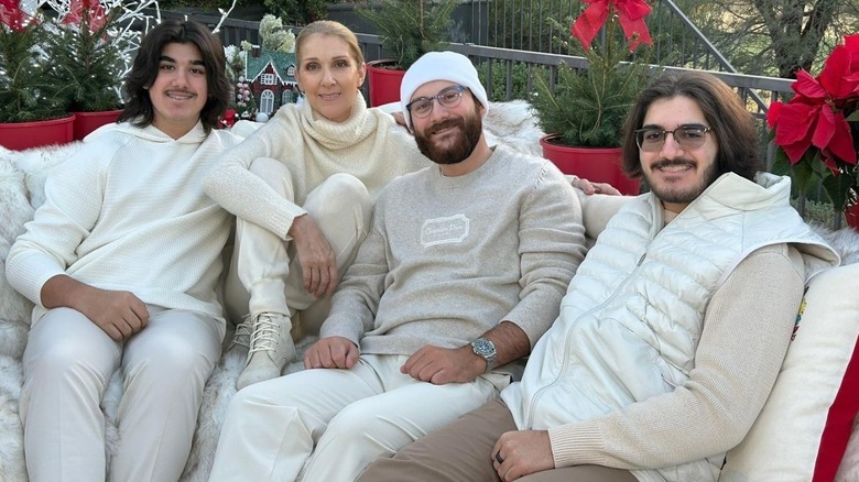 Celine Dion posing with her three sons