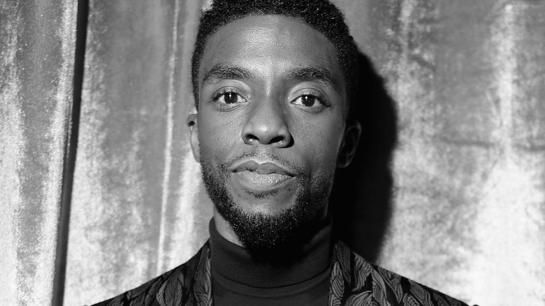 Chadwick Boseman smiling, image in black and white