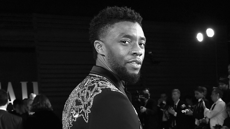 Chadwick Boseman looking back black and white