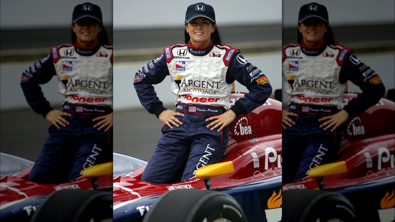 Danica Patrick sits on her racecar in 2005